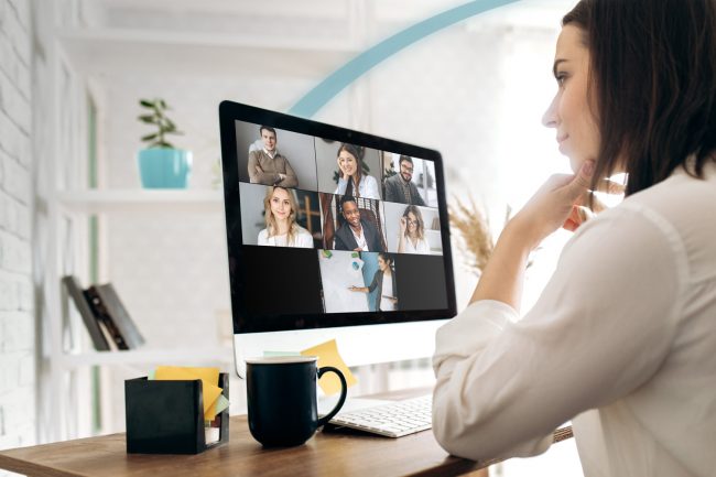 Lady having virtual zoom Fuse Webex Teams call with colleagues