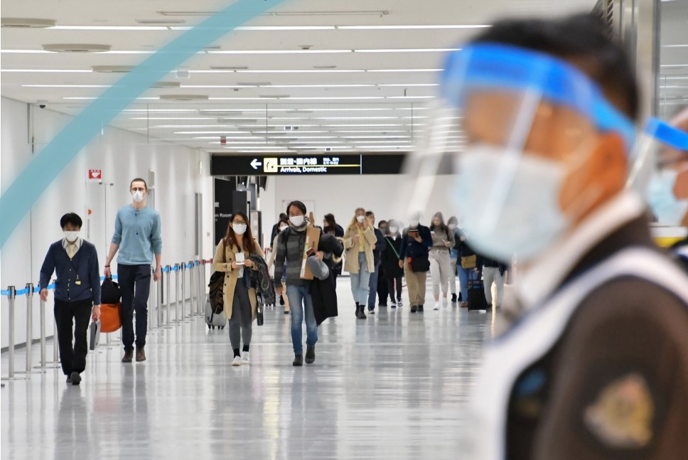 Travellers having to wear masks at an airport terminal during the COVID19 pandemic
